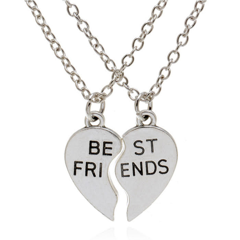 Set of best friends best buds heart necklace shoot outside in a summer day  closeup. Selective Focus Stock Photo by ©Bogdancariman@gmail.com 462108134